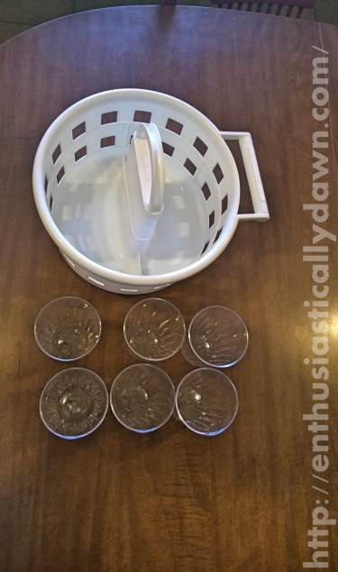 I used this caddy which originally held baby bath products. Also six plastic cups, leftover from a holiday party.